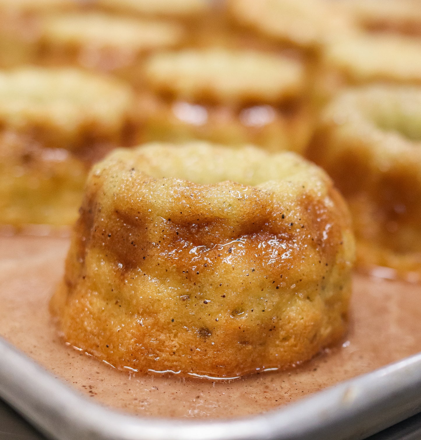 Small blueberry lemonade vodka cake with a glaze finish on a plate